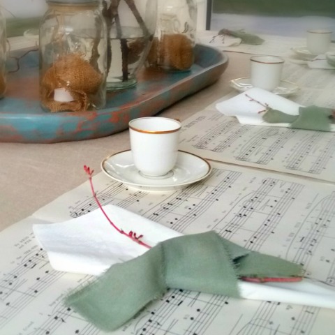 Christmas table place setting with music sheets and French China