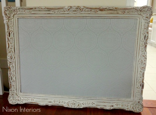 perisian inspired upholstered cork board with old distressed picture frame