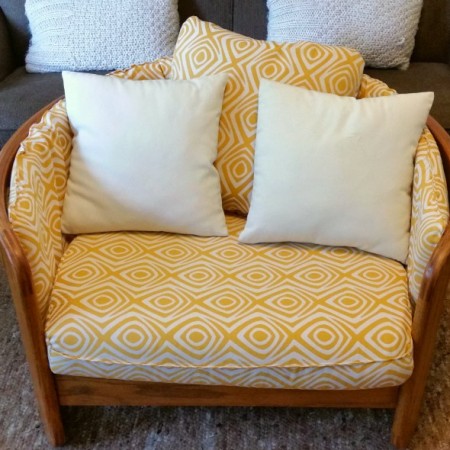 solid oak bentwood chair done in a yellow and cream mid century inspired fabric